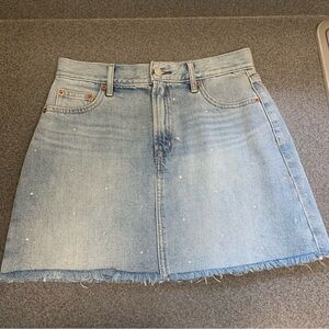 Gap denim mini skirt rhinestone accents, a raw frayed hem Size 27 / 4 Festival